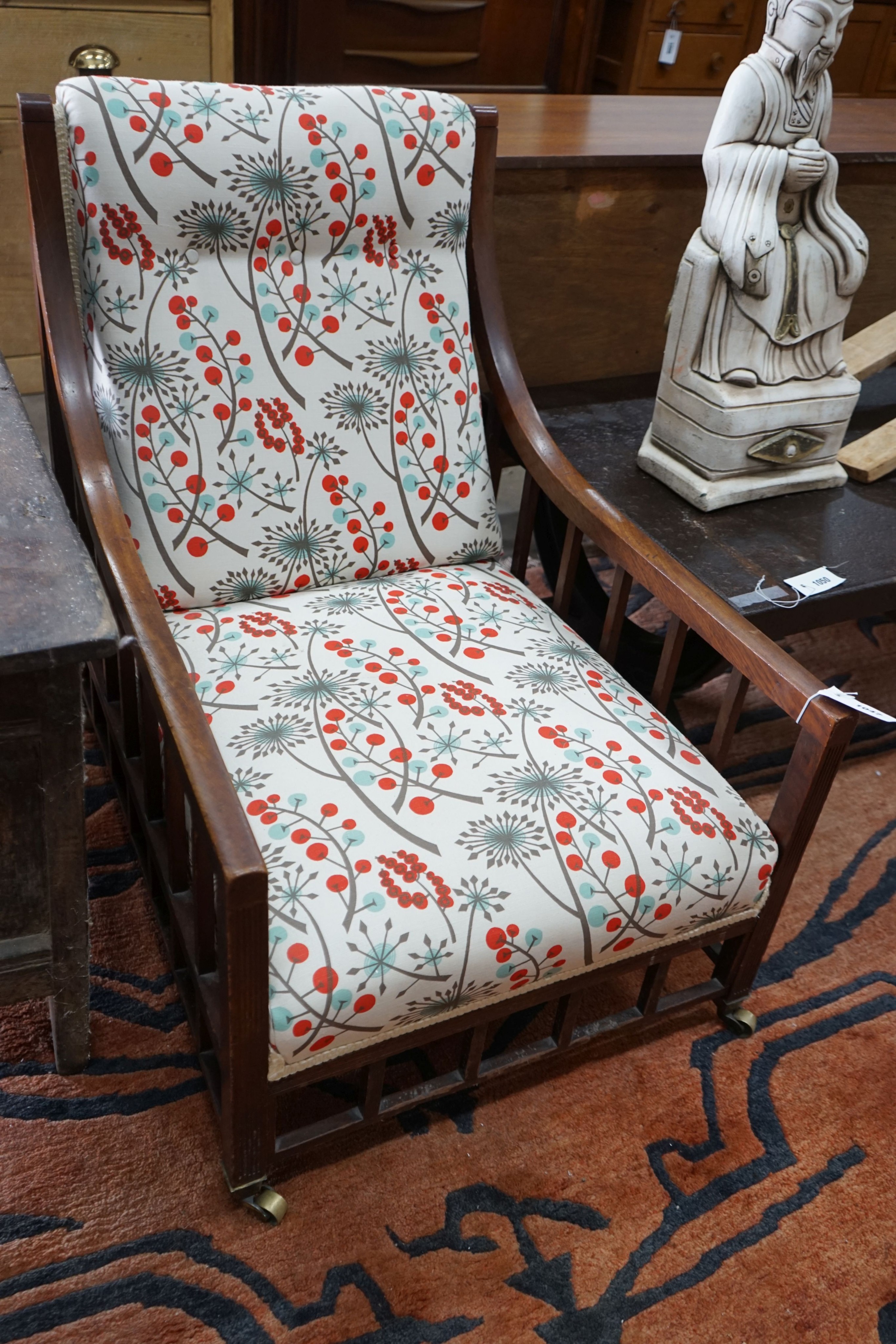 An Arts and Crafts mahogany armchair, recently re-upholstered, width 60cm, depth 82cm, height 82cm